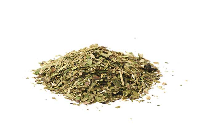 A Pile of Green Dried Yerba Mate Tea Leaves.