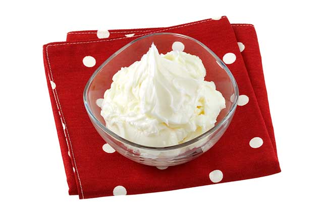 Glass Bowl of Vegetable Shortening On a Red Cloth.