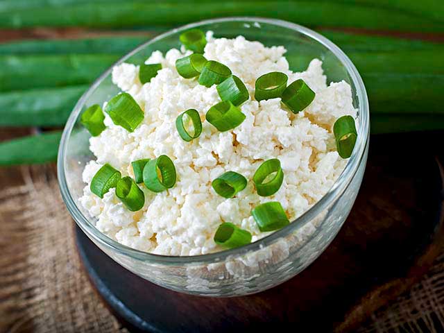 Homemade Cottage Cheese In a Glass Bowl.