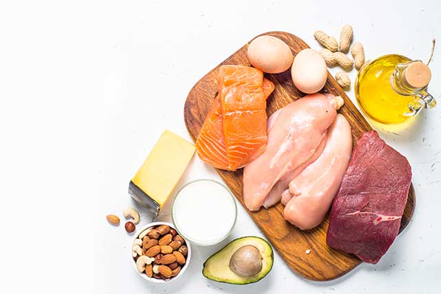 Ketogenic Diet Foods On Table - Meat, Fish, Nuts, Cheese, Oil.