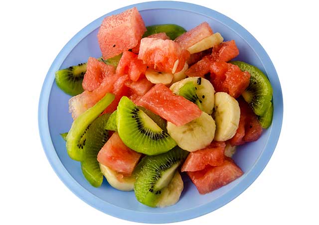 Mixed Fruit On a Plate - Berries, Banana, Kiwi, Watermelon.