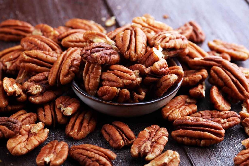 A Pile of Pecans On a Table.