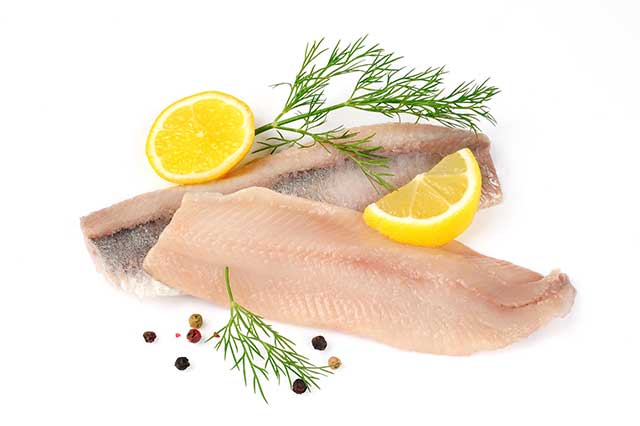 Two Herring Fillets With Lemons and Herbs.