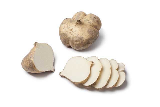 Whole and Sliced Jicama Root Vegetable.