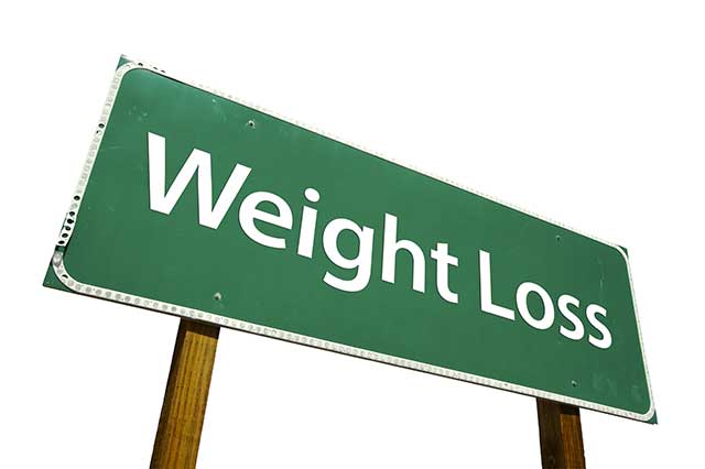 A Green Road Saying Saying "Weight Loss".