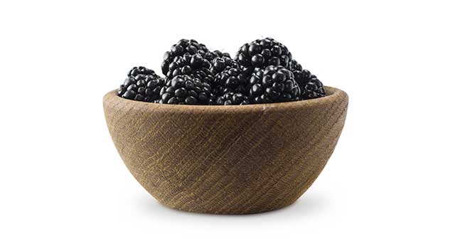 Numerous Blackberries In a Wooden Bowl.