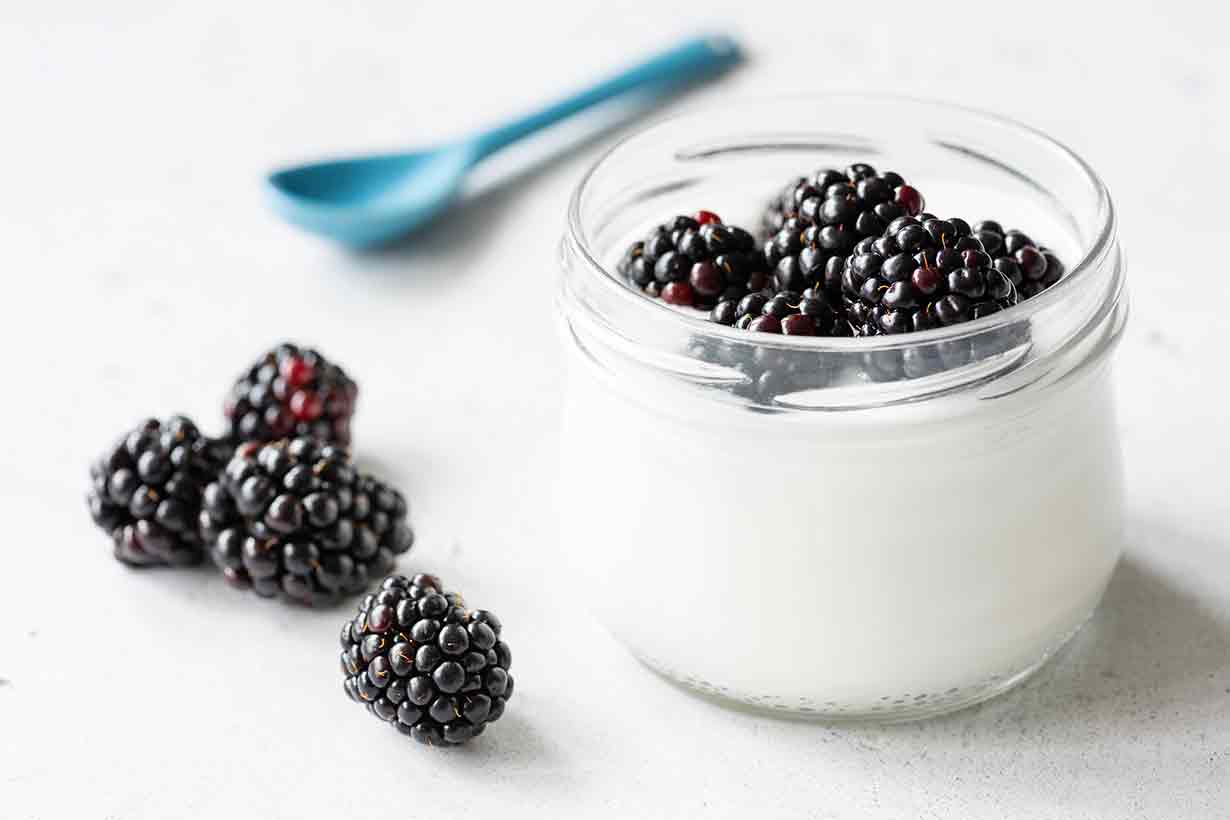 Blackberries With Yogurt In a Glass.