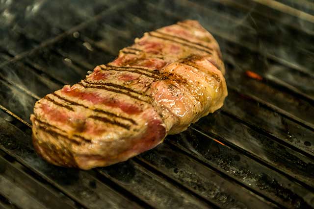 Flame-Grilled Top Sirloin Cooking.