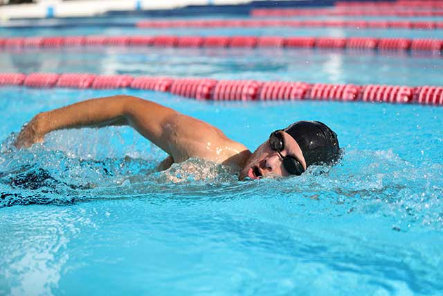 A Professional Swimmer In the Middle of a Race.