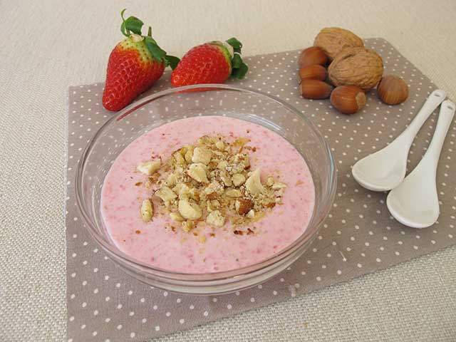 Strawberry low-fat Greek yogurt with nuts.