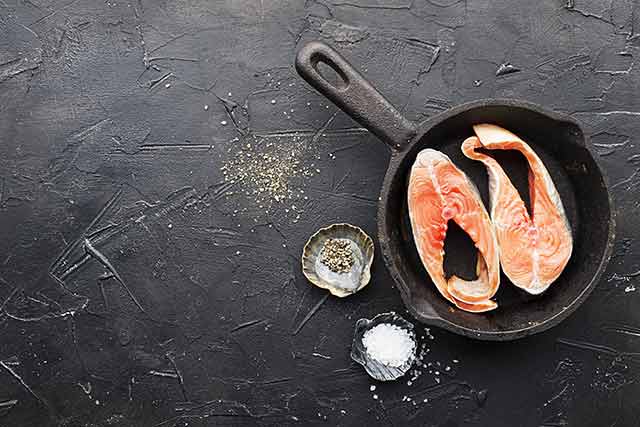 Pink Salmon Fillets In a Cast Iron Pan.