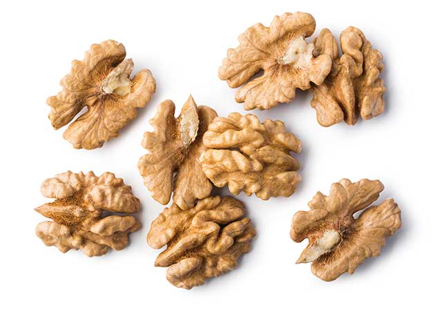 Several Walnuts In a Pile.