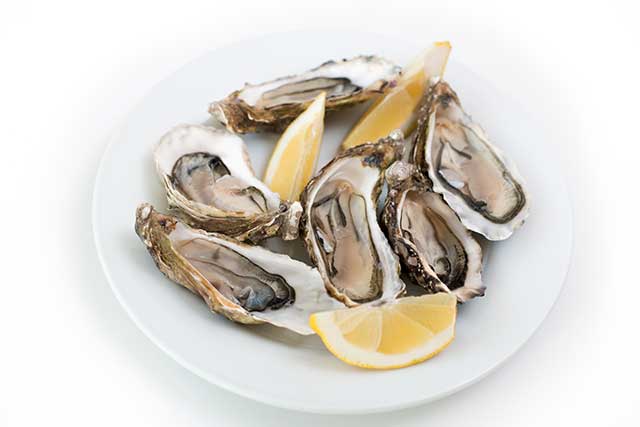 Fresh Oysters With Slices of Lemon.