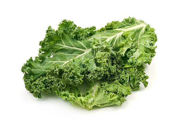 Several Kale Leaves On a White Background.