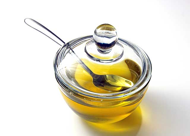 Liquid Ghee In a Glass Container.