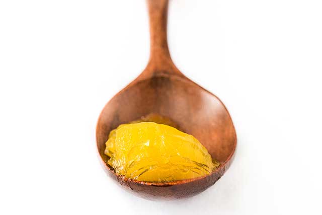 Wooden Tablespoon Serving of Ghee.