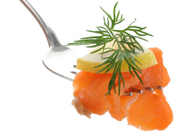 Smoked Salmon With Lemon On a Fork.