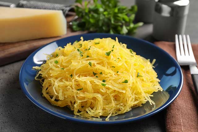 Spaghetti Squash "Noodles" On a Blue Plate.