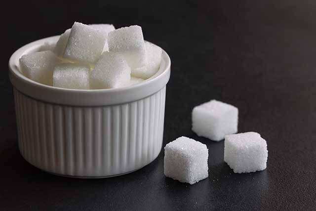 Sugar Cubes In a White Bowl.