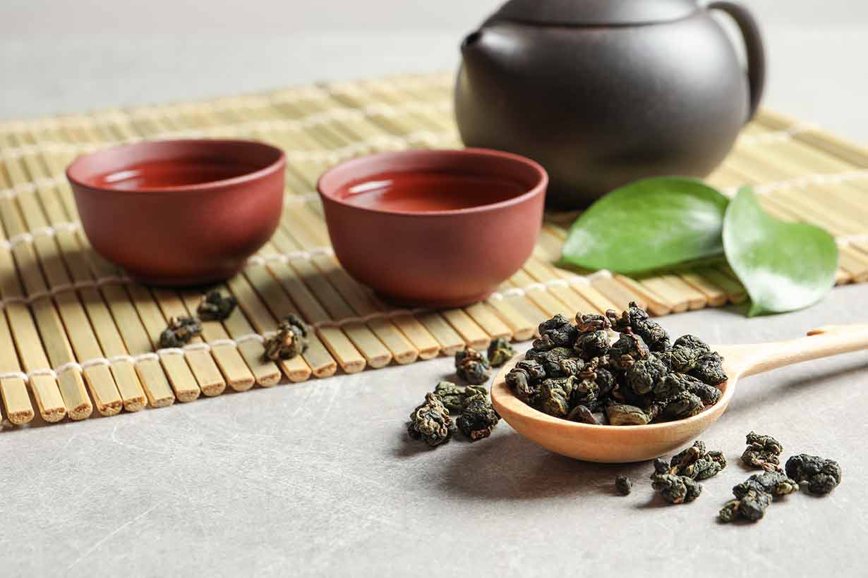 Dried Oolong Tea On a Wooden Spoon.