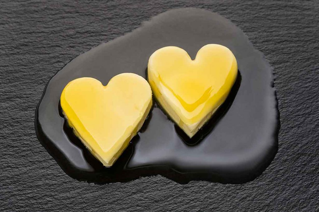 Two Heart-Shaped Pieces of Butter Starting To Cook.