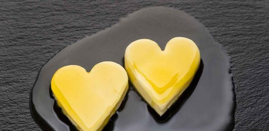 Two Heart-Shaped Pieces of Butter Starting To Cook.
