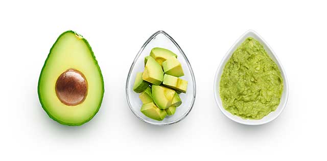 Half an Avocado, Chopped Pieces, and Guacamole In Three Dishes.