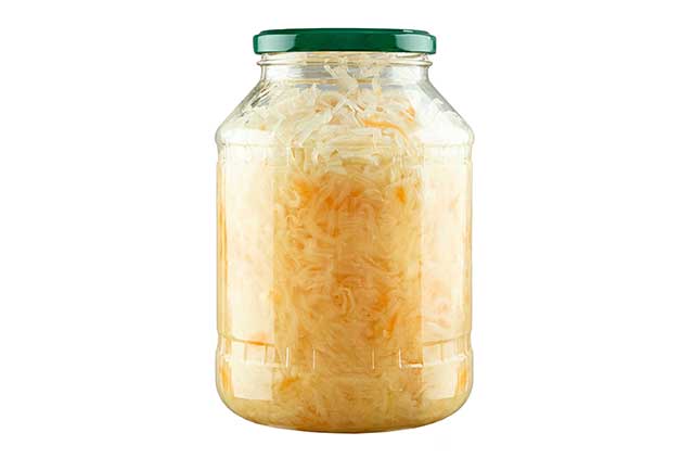 Fermented Sauerkraut In a Clear Glass Jar.