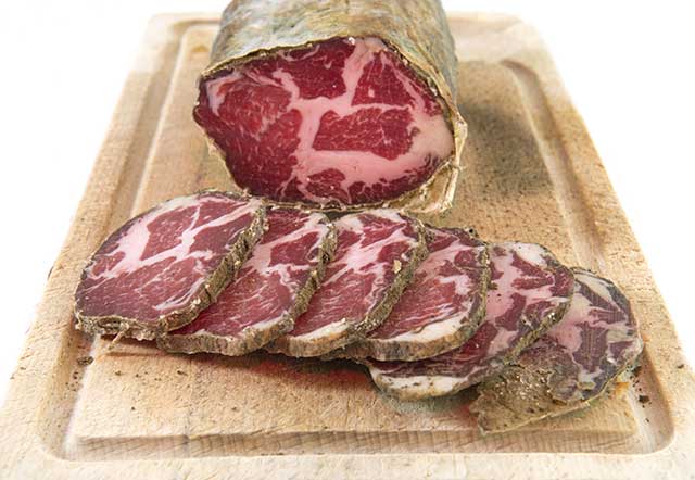 Capocollo Cured Italian Meat Sausage and Slices.