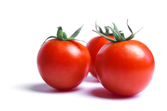 Close-up Photo of Three Fresh Red Tomatoes.