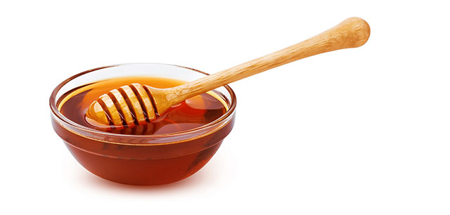 Honey In a Glass Bowl.