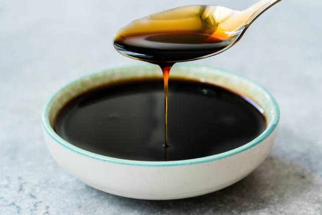 Bowl of Molasses and a Spoon.