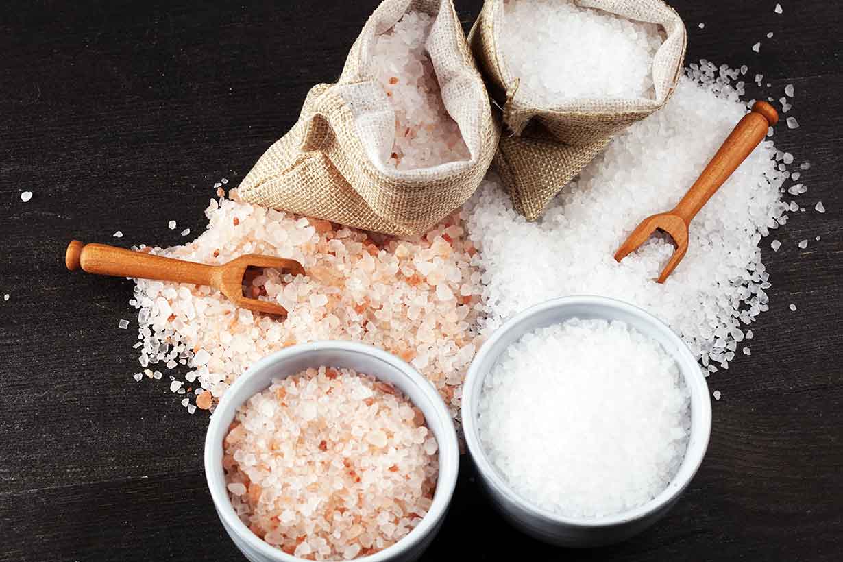 Himalayan and Sea Salt Crystals On Table.