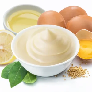 Mayonnaise next to ingredients used to make it (oil, egg, lemon).