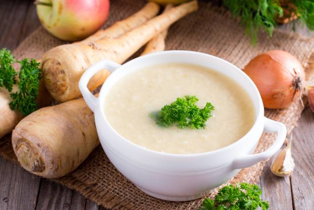 Parsnip Cream Soup In a White Bowl.