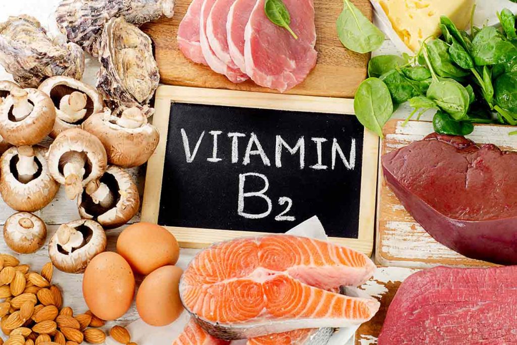 Foods High In Vitamin B2 With a B2 Sign in the Middle.