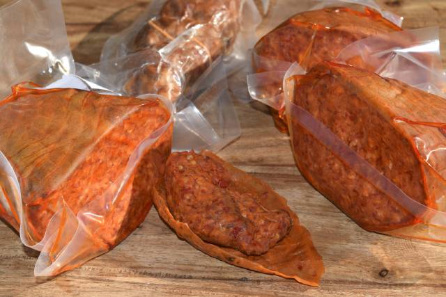 Various Nduja Products On a Wooden Surface.