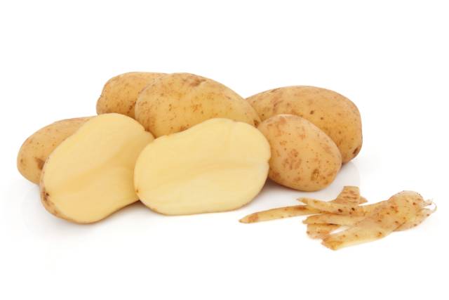 Group of Peeled and Unpeeled Maris Piper Potatoes.