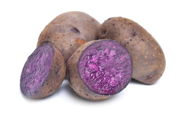 Vitelotte Potatoes - Whole and Halved.