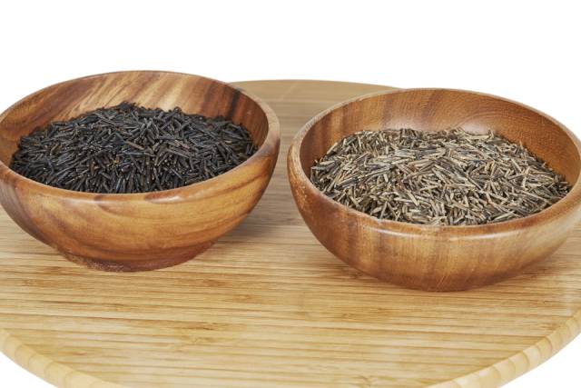 Different Strains of Wild Rice In Two Wooden Bowls.