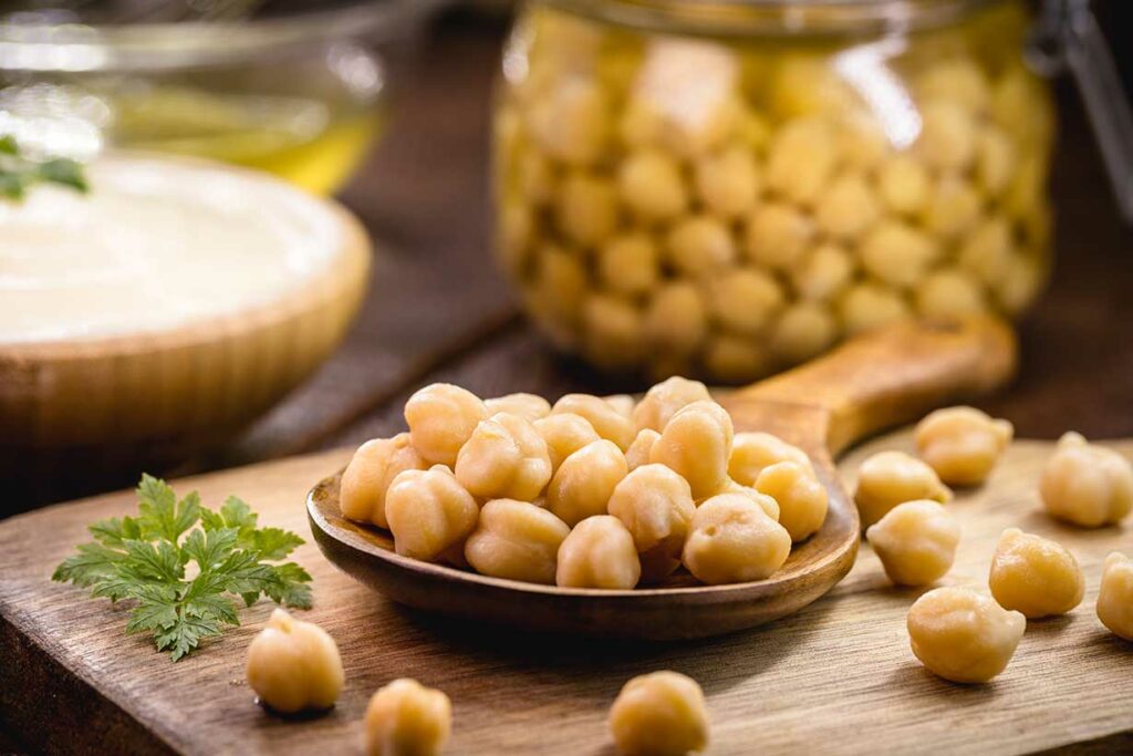 Chickpeas On a Wooden Spoon.