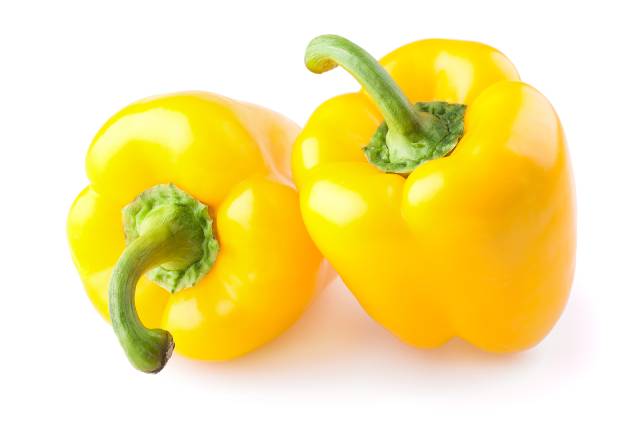 Two Whole Yellow Bell Peppers.