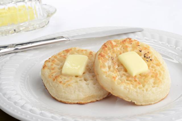 A Plate of Crumpets With Butter.