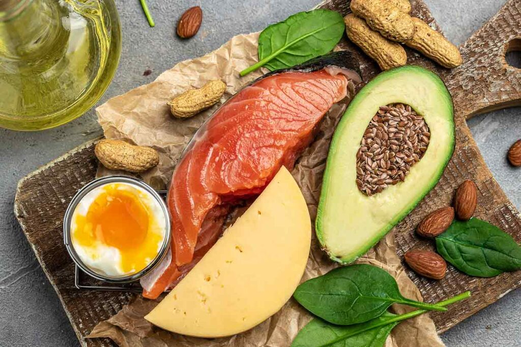 Low-carb, nutrient-rich foods: salmon, eggs, avocado, seeds, greens.