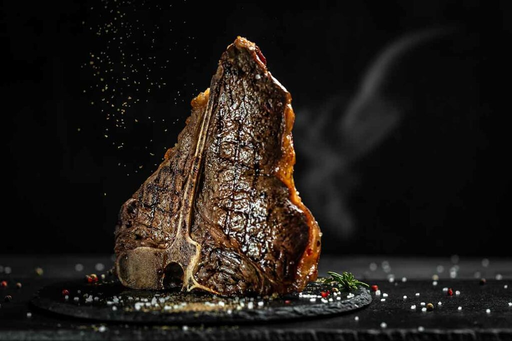 A T-Bone Steak Being Cooked.