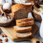 A Loaf of Bread and Various Ingredients Used To Make Different Types of Bread.