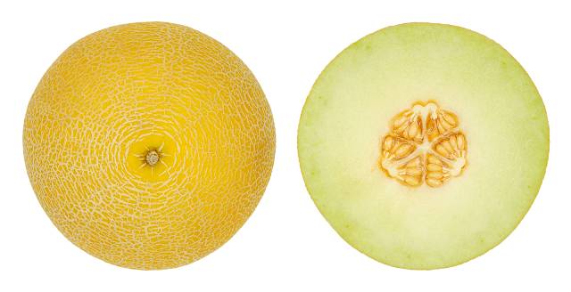 A Galia Melon Cut In Half - Showing Flesh and Skin.