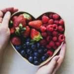 Various Berries In a Heart-Shaped Bowl - Low-Carb Fruit Theme.