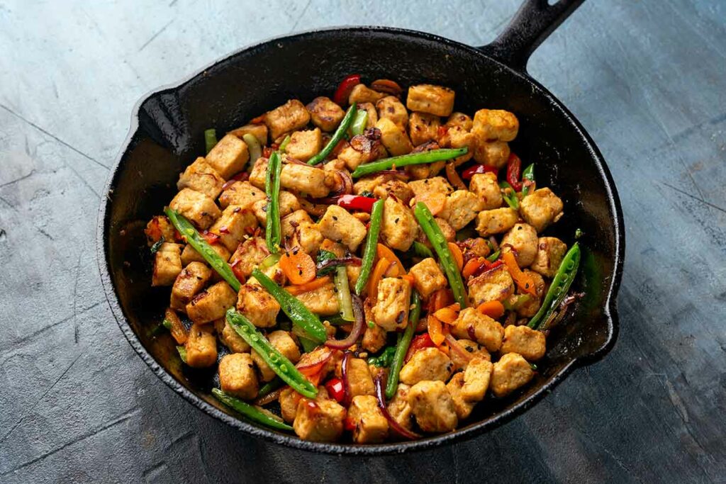 Quorn Mycoprotein Pieces In a Cast Iron Pan (Stir-Fry).