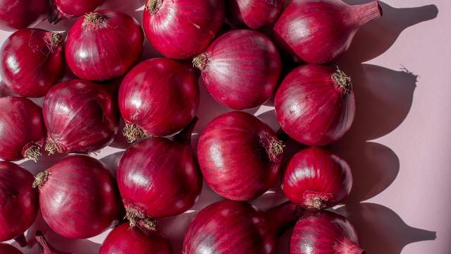 Red onions grouped together.